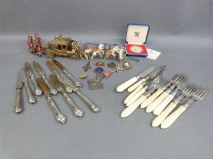 A collection of badges, coins, silver collared,