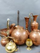 A collection of copper and brass ware including hammered ginger jars.