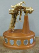 A Devilbliss presentation paint spray gun on presentation plinth