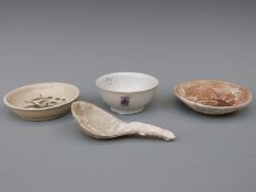 A Chinese blue and white dish, decorated in the central well pattern,