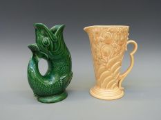 Two jugs to include an Art Deco example by Wade relief moulded with flowers,