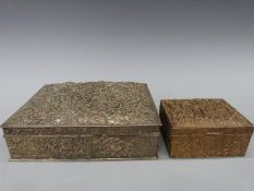 Two Japanese embossed metal jewellery boxes, one decorated with flowers and velvet lined (20x15.