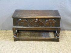 A carved oak box (H40 x W66 x D29cm)