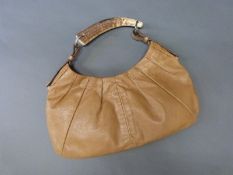 A vintage Yves Saint Laurent 'Mombasa' tan leather handbag, with deer antler handle,