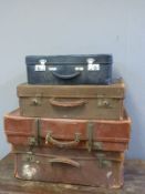 Four vintage leather and other suitcases