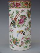 A 19thC Chinese famille rose brush pot decorated with birds, flora and fauna,