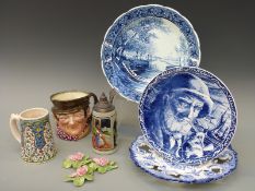 Three Delft blue and white chargers together with a Royal Doulton character jug, tankards etc.