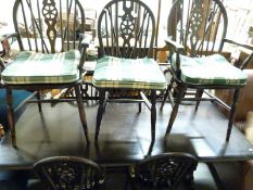 An Ercol 6+2 dining suite (table H76 x L183 x W82)