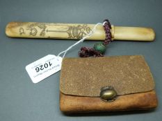 A Japanese bone case with carved scene of a basket of fruit on a table and signature to one side,