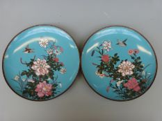 A pair of 19thC Japanese cloisonne chargers decorated with peonies, chrysanthemums and birds,