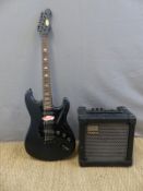 An electric rhythm/lead guitar in black finish with soft Ritter carry case together with a Roland