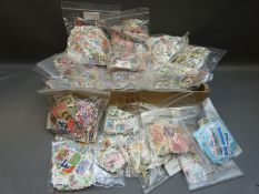 A very large quantity of loose stamps sorted into countries,