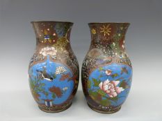 A pair of late 19th/20thC Japanese cloisonne vases with decoration of birds,