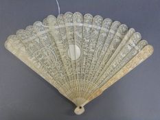 A 19thC Cantonese carved ivory brise fan depicting scenes of animals and flowers, 18cm long.