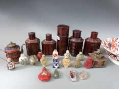 A collection of Chinese and Japanese scent bottles and tea caddies