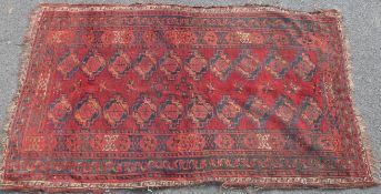 A Turkoman rug on a wine ground 187cm x 110cm