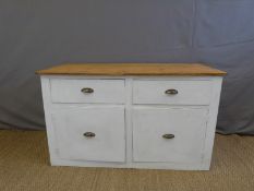 A painted pine topped sideboard with two drawers over two cupboards (W134 x H79 x D62cm)