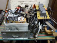 A quantity of tools to include drills, trolley jack, hand tools, animal trap etc.