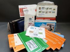 A large box of Channel Island and Isle of Man stamp packs,