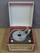 Dansette c1960s portable electric record player with four speed deck in pink and grey Rexine type