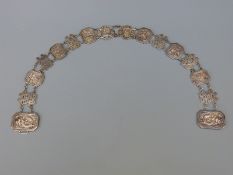 A Chinese white metal belt decorated with dragon, floral, rabbits and Chinese characters, length 75.