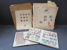 A collection of Commonwealth stamps on loose album pages,