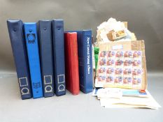 A collection of albums of all world stamps including Canada,