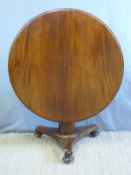A mahogany tilt top table (diameter 103cm)