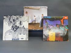 A small collection of eighteen albums including The Beatles, Stones, Jam and UK Subs,