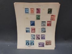 A collection of Austrian stamps on loose album pages,