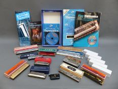 A collection of harmonicas to include Hohner & Lark, various keys including A, C, D,