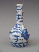 Chinese blue and white bottle vase decorated with cranes amongst clouds, Qianlong mark to base,
