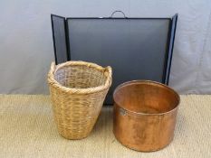 A copper planter, fire screen and wicker log basket.
