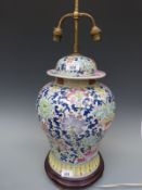 A 20thC enamelled Chinese lamp on wooden base (65cm tall)