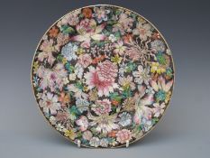 A 19thC Chinese famille noir millefiori footed plate with six character Kuong Hsu mark to base with