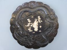 A Japanese Meiji period charger with bone and mother of pearl Shibayama figural decoration in