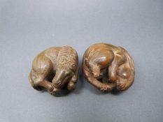 Two Japanese carved wooden netsukes,
