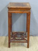 A Chinese side table with a pierced shelf below (77cm tall)