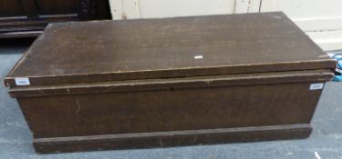 A stained pine trunk with looped metal handles (H31 x L97 x D42cm)