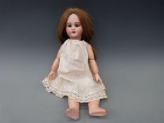 A DEP bisque headed girl doll, possibly Jumeau, with open mouth, weighted brown eyes,