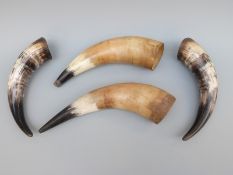 Four cow or buffalo horn vessels possibly for water carrying or conversion to powder flasks.