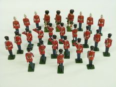 Twenty-six Britains and similar lead soldiers comprising 17 Guardsmen and nine others including