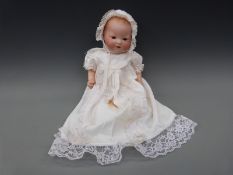 An Armand Marseille bisque headed baby doll with open mouth,