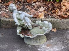 A lead bird bath with cherub to top,