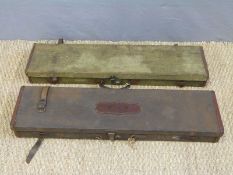 Two indistinctly named canvas and leather side by side double barrelled gun cases both with brass