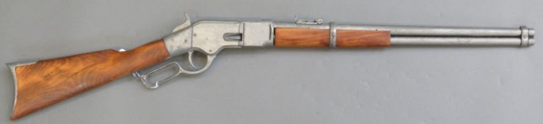 Winchester style underlever hammer action gun with adjustable sights and 20 inch barrel,