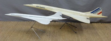 Two large scale Concorde models on stands, possibly ex shop/travel agent display,