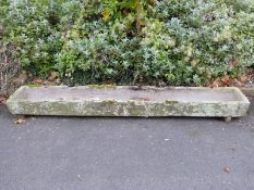 A carved natural stone trough (L275 x W43 x H20cm)