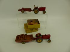 Five Dinky Toys diecast model agricultural vehicles including Massey-Harris tractors and Hay Rake