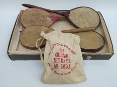 A late 19th/ early 20thC vellum and leather tennis set comprising two pairs of bats one marked